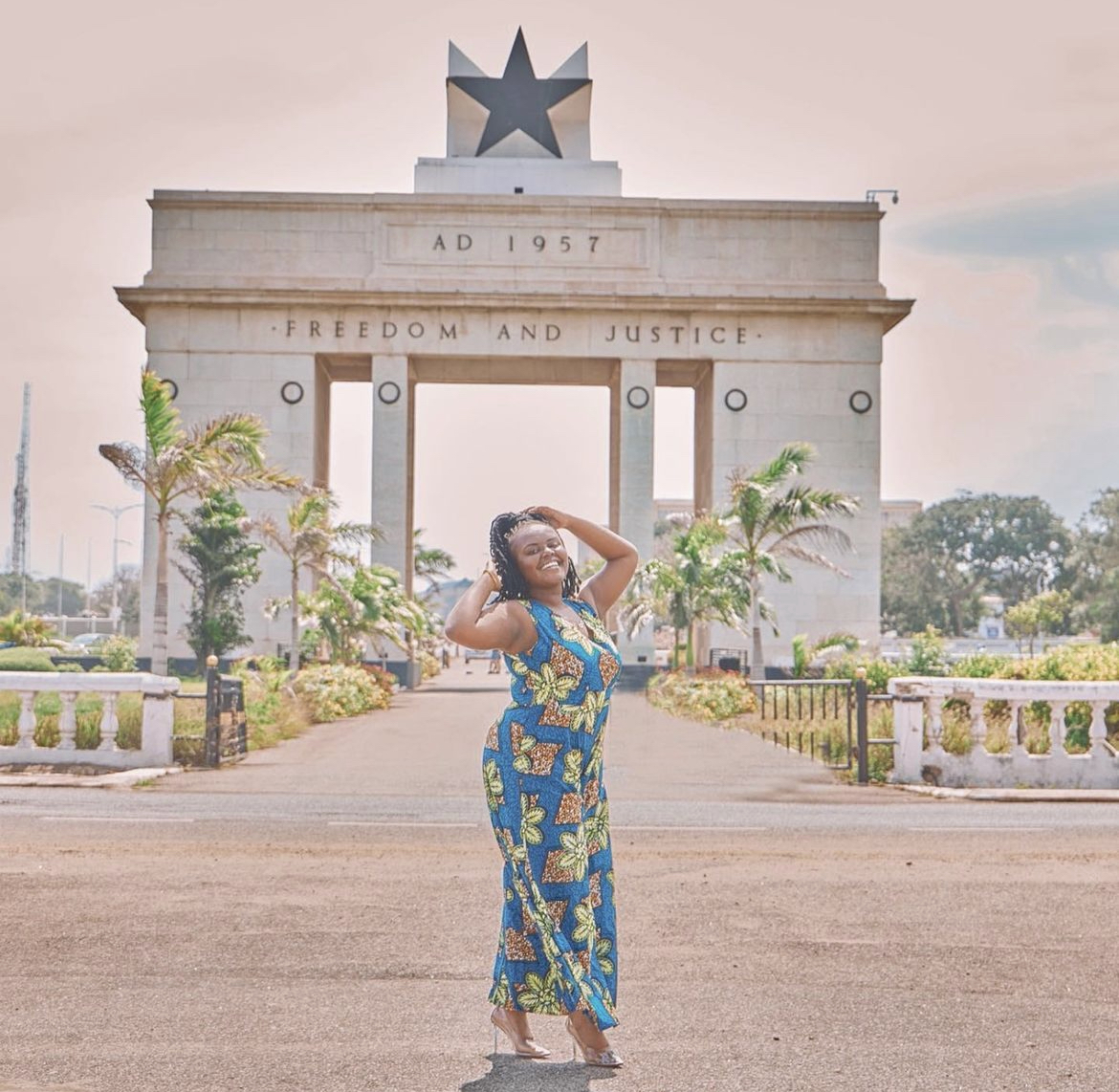 Blogger Christina Jane posing in front of the Black Star Square in Ghana. 