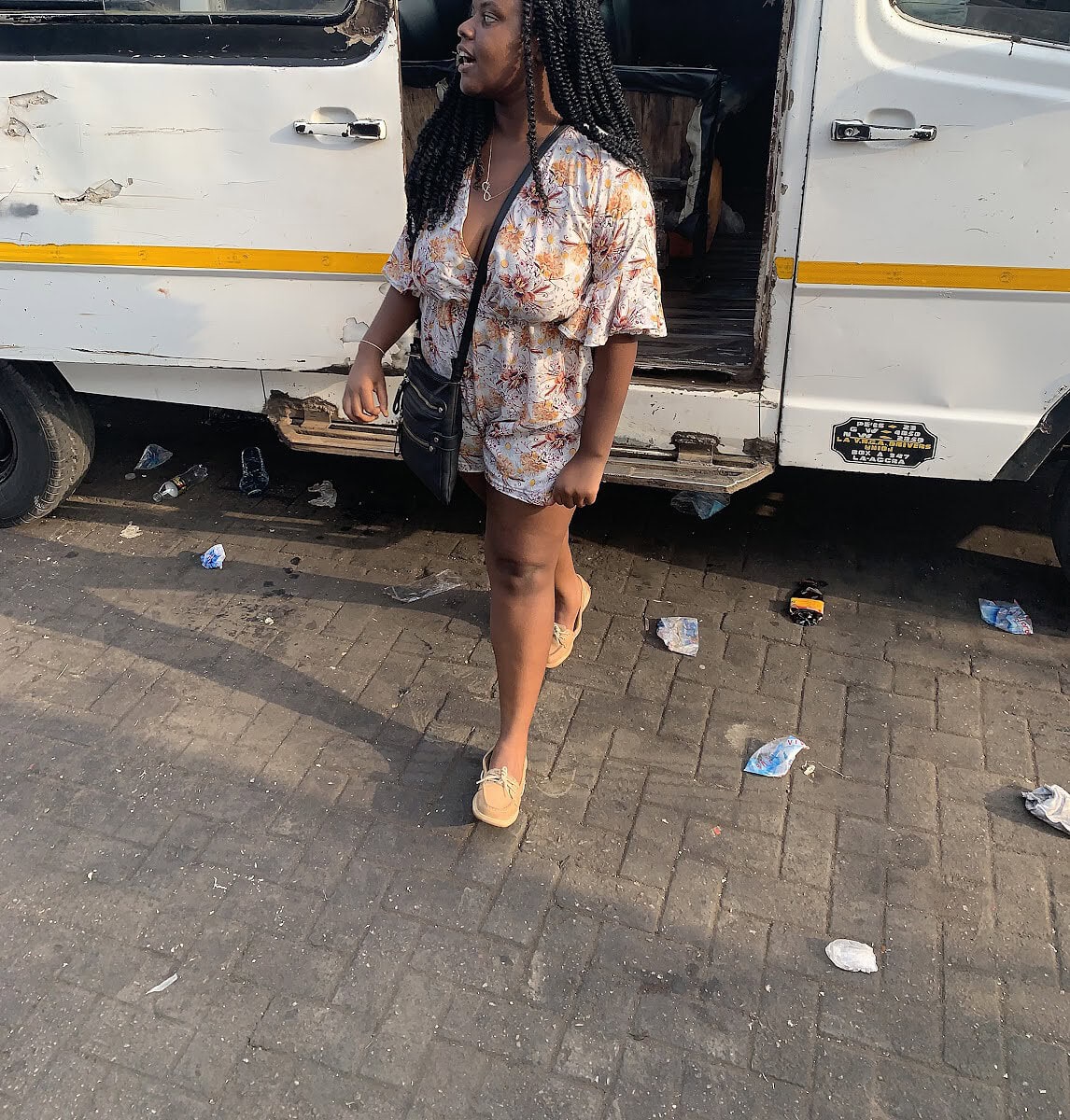 Blogger Christina Jane walking in front of a tro tro