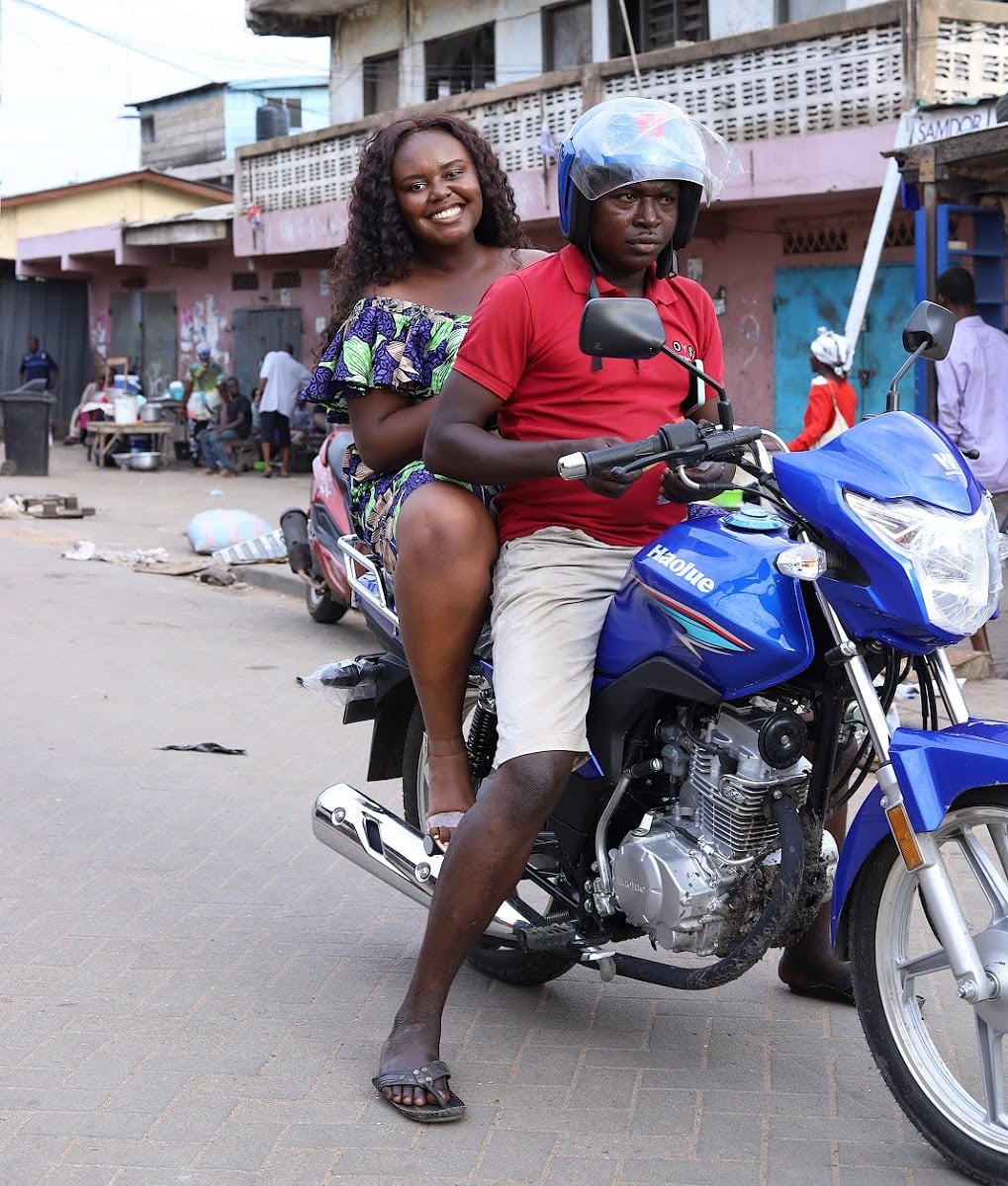 Blogger Christina Jane on the back of a motorcycle with the rider.