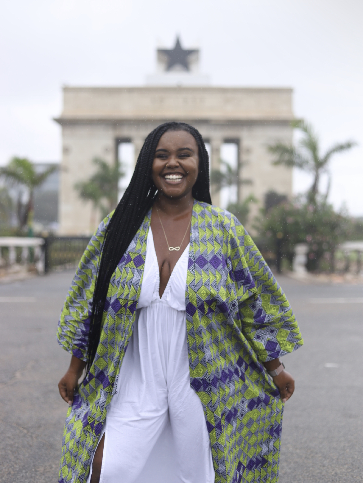 Blogger Christina Jane standing in front of the Ghana Independence Square smiling 