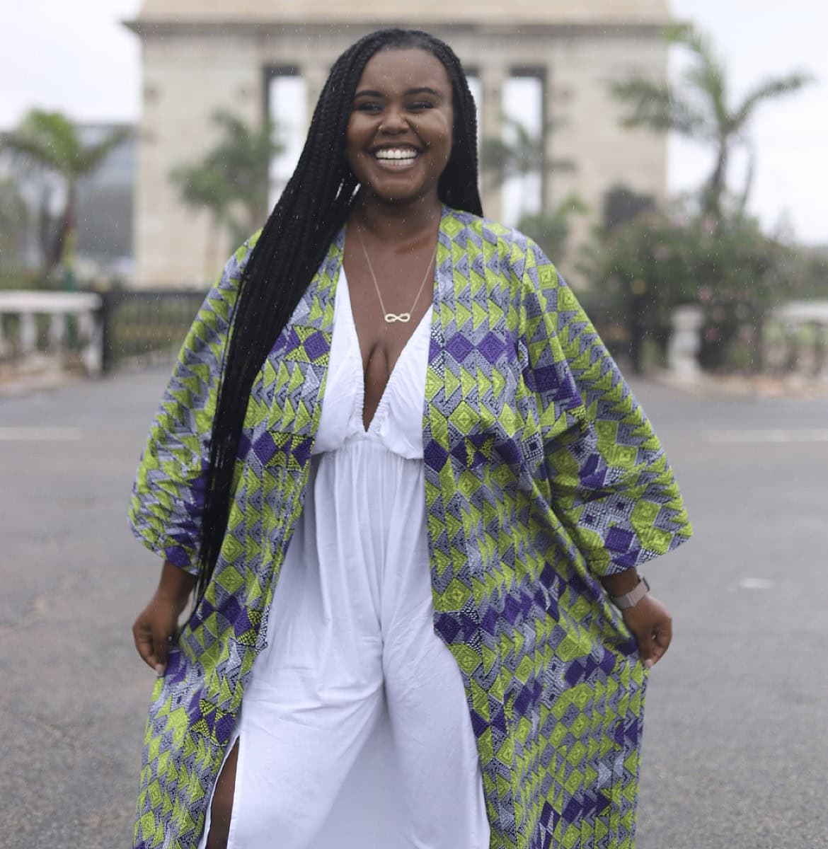 Blogger Christina Jane standing in front of the Ghana Independence Square smiling