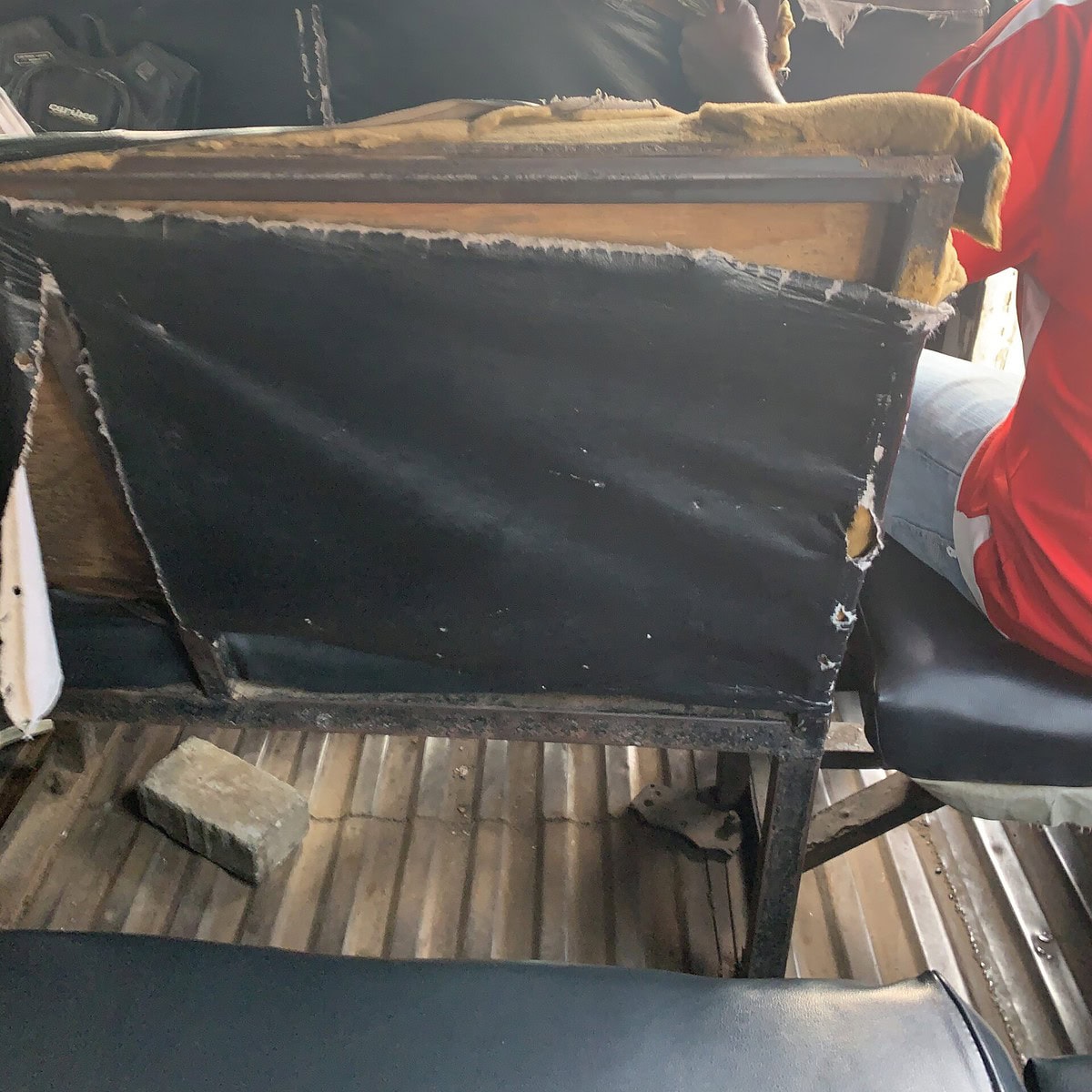 A worn out seat on a tro-tro 