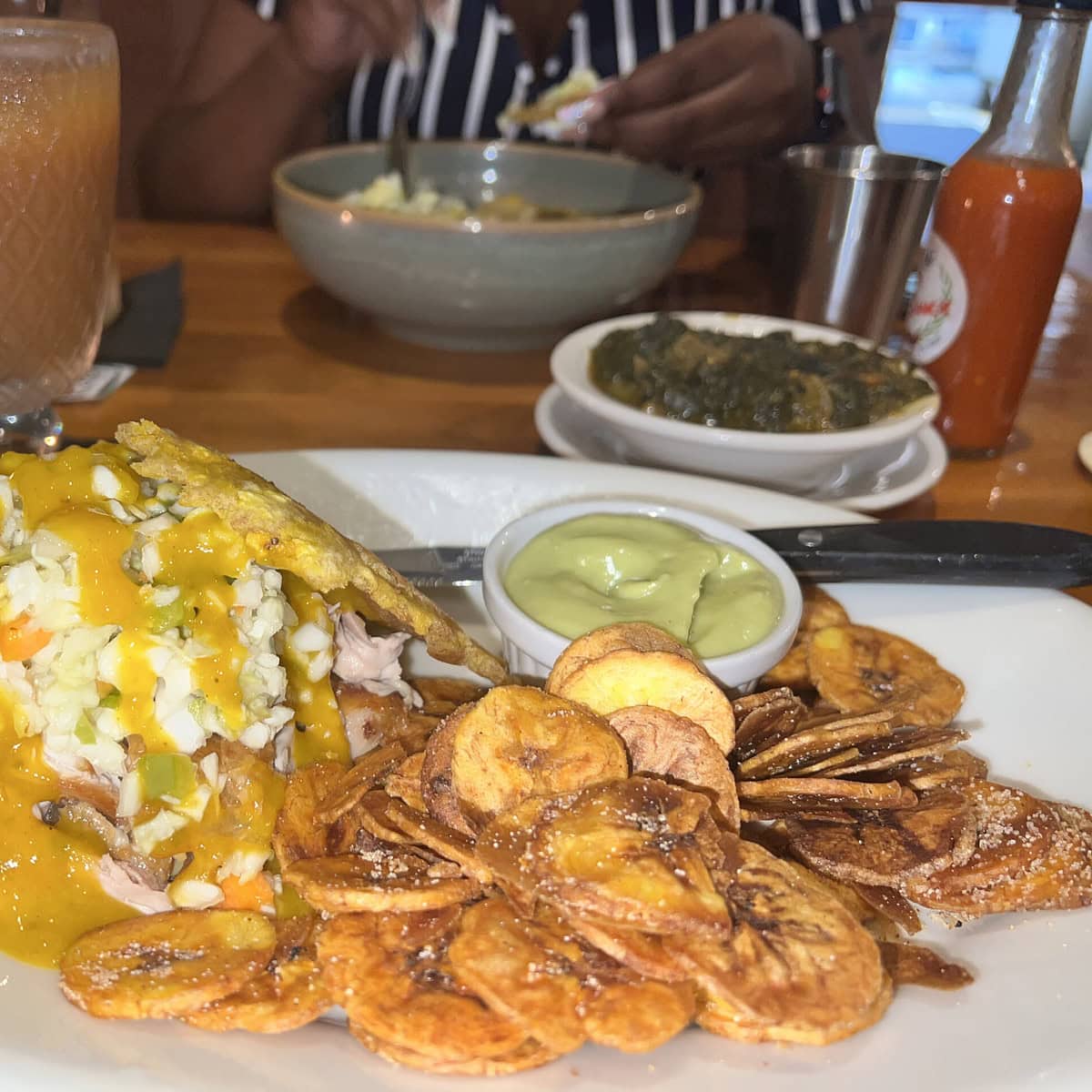 A Fritai sandwich with plaintain chips. 