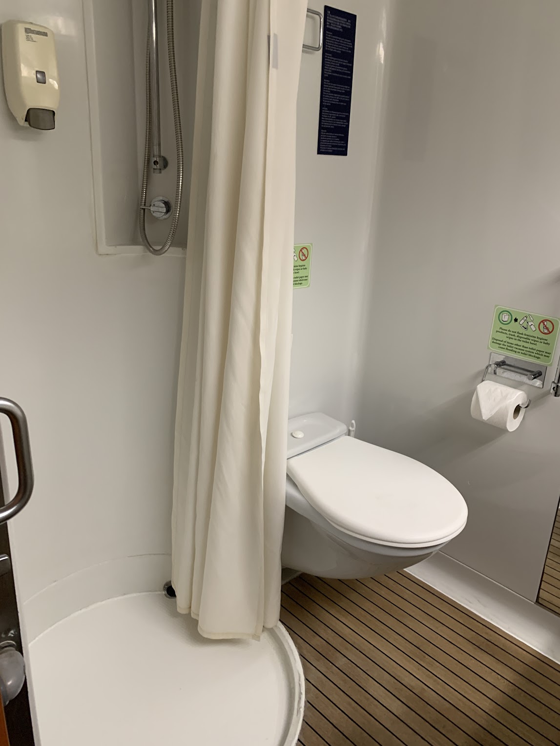 The Margaritaville at Sea interior stateroom bathroom showing the shower and bathroom.
