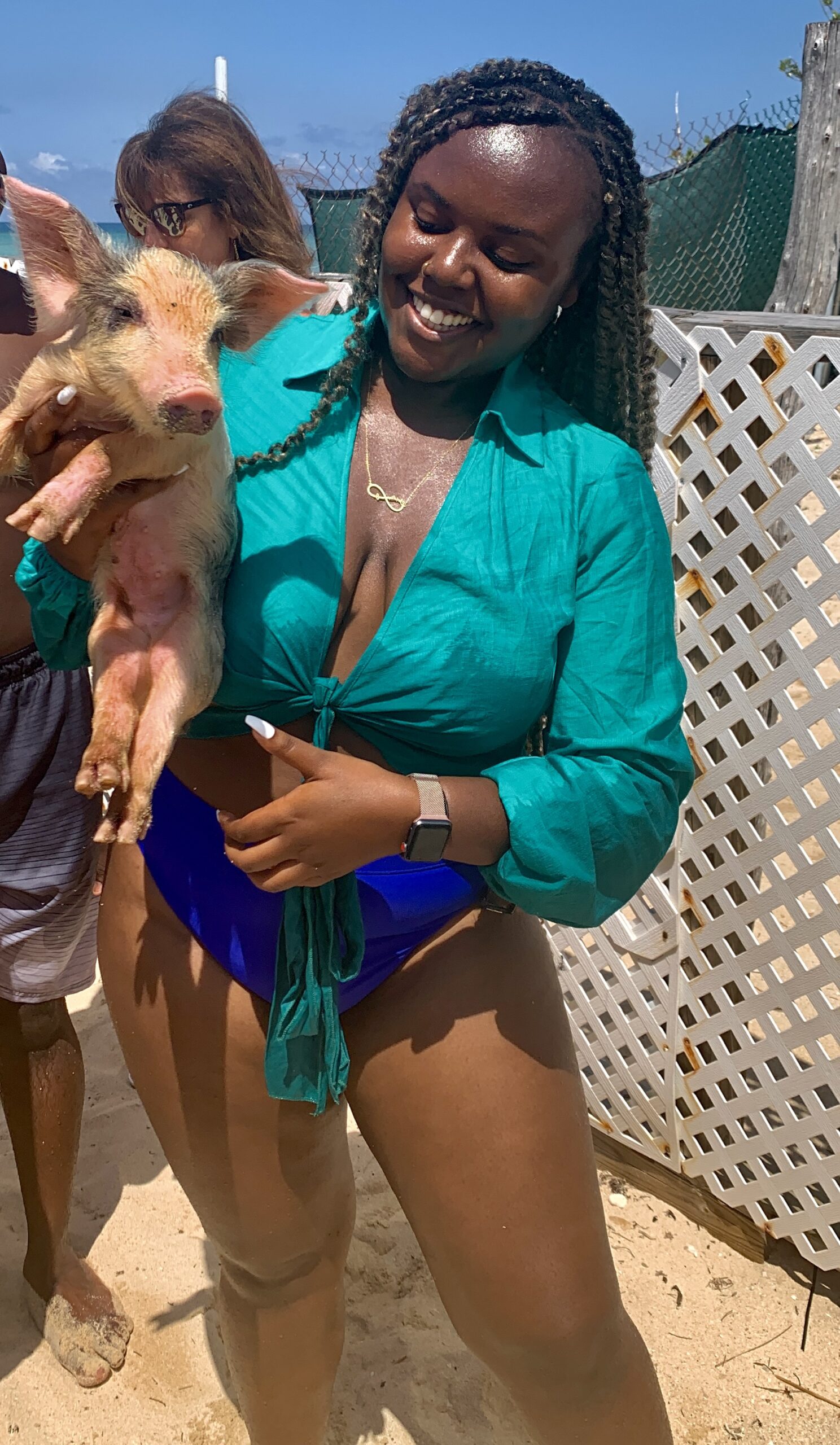 Blogger Christina Jane holding a pig in the Bahamas 