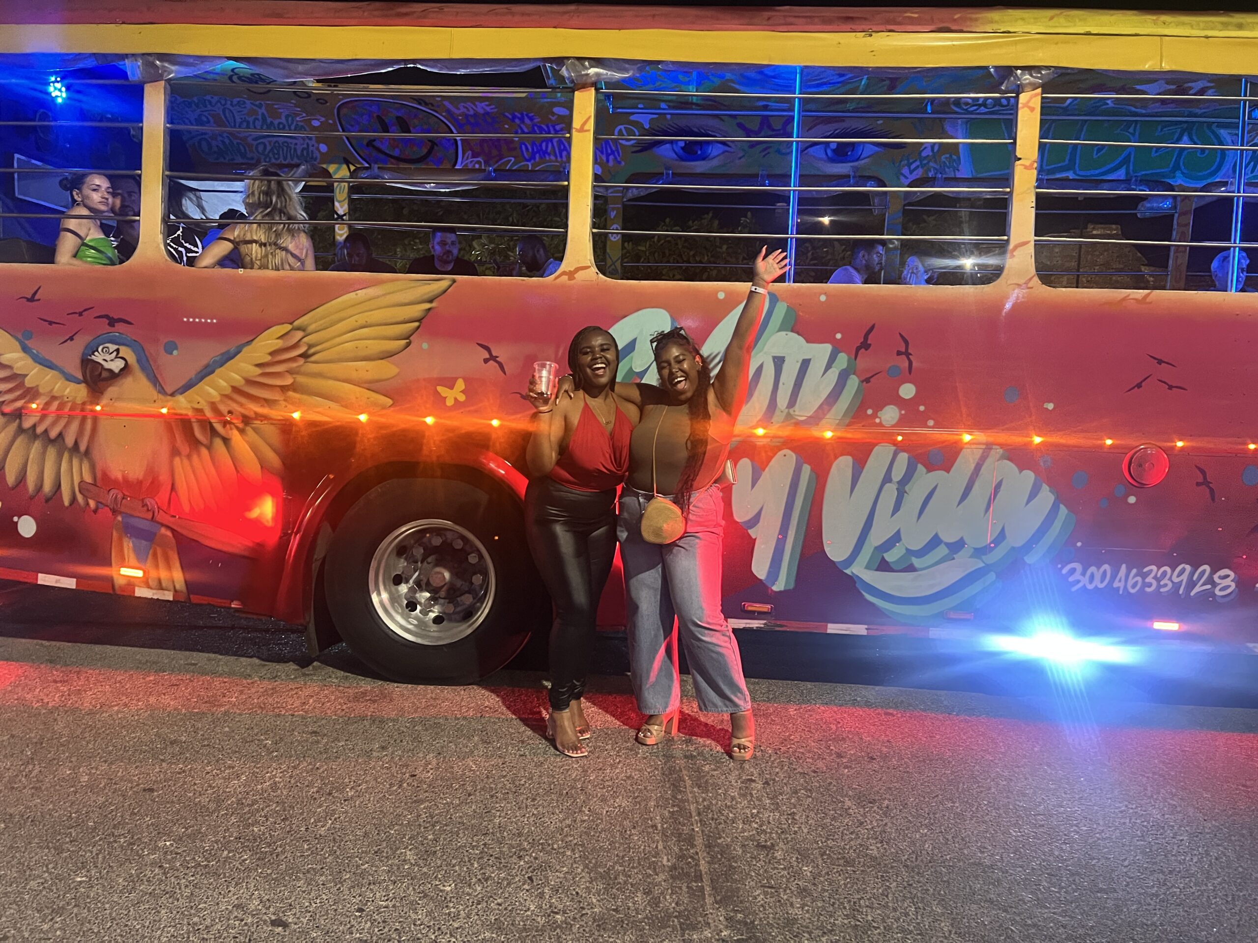 Christina Jane and her friend Shang in front of the Chiva Party Bus 