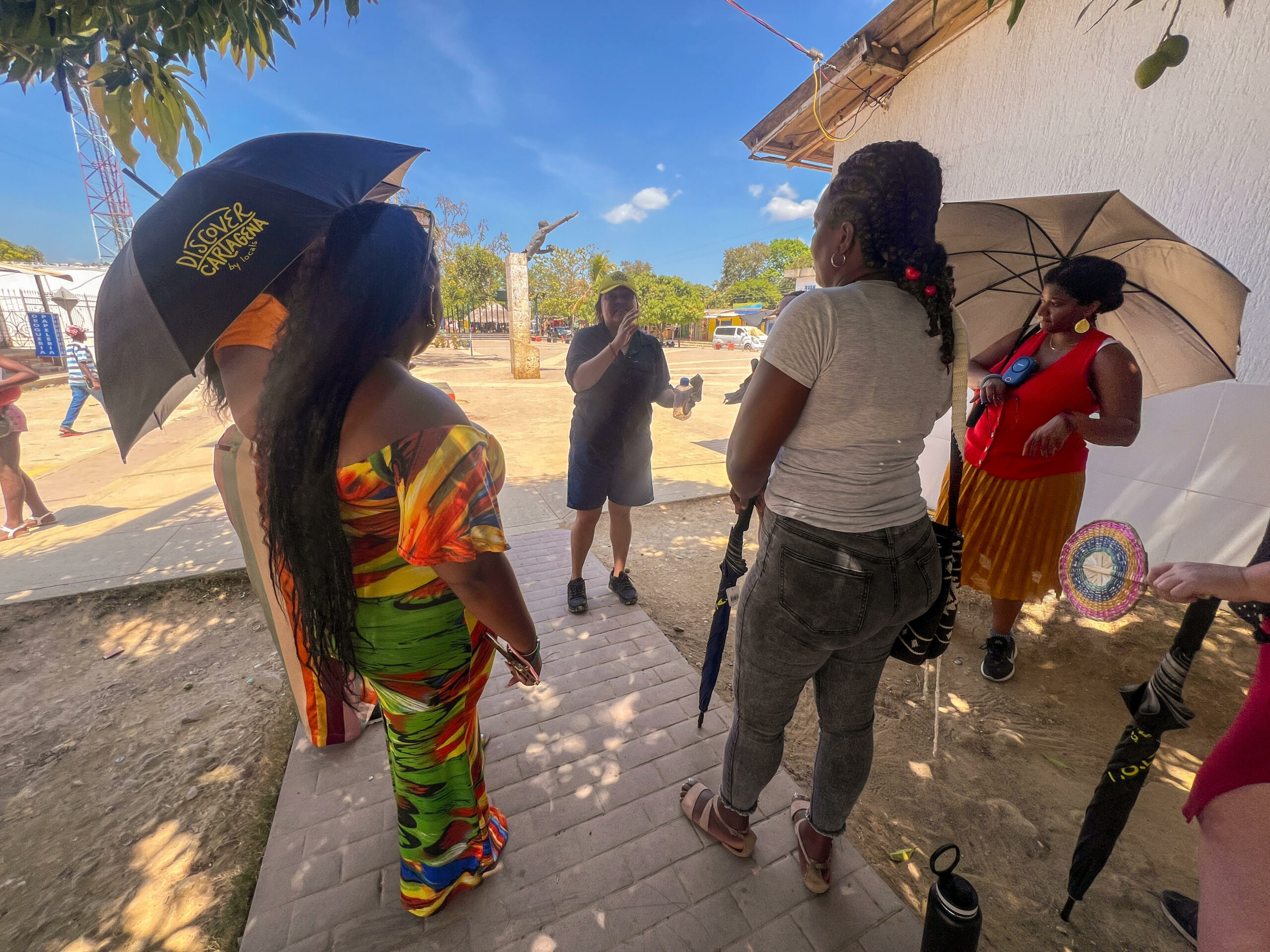 A tour group listening to the tour guide 