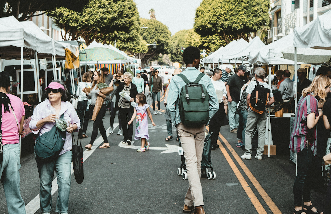 People waking in a farmers market 