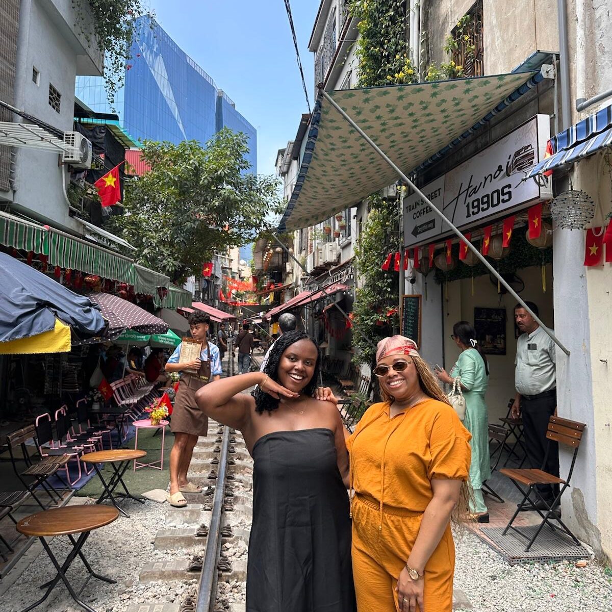 Christina Jane and her friend at Train Street 
