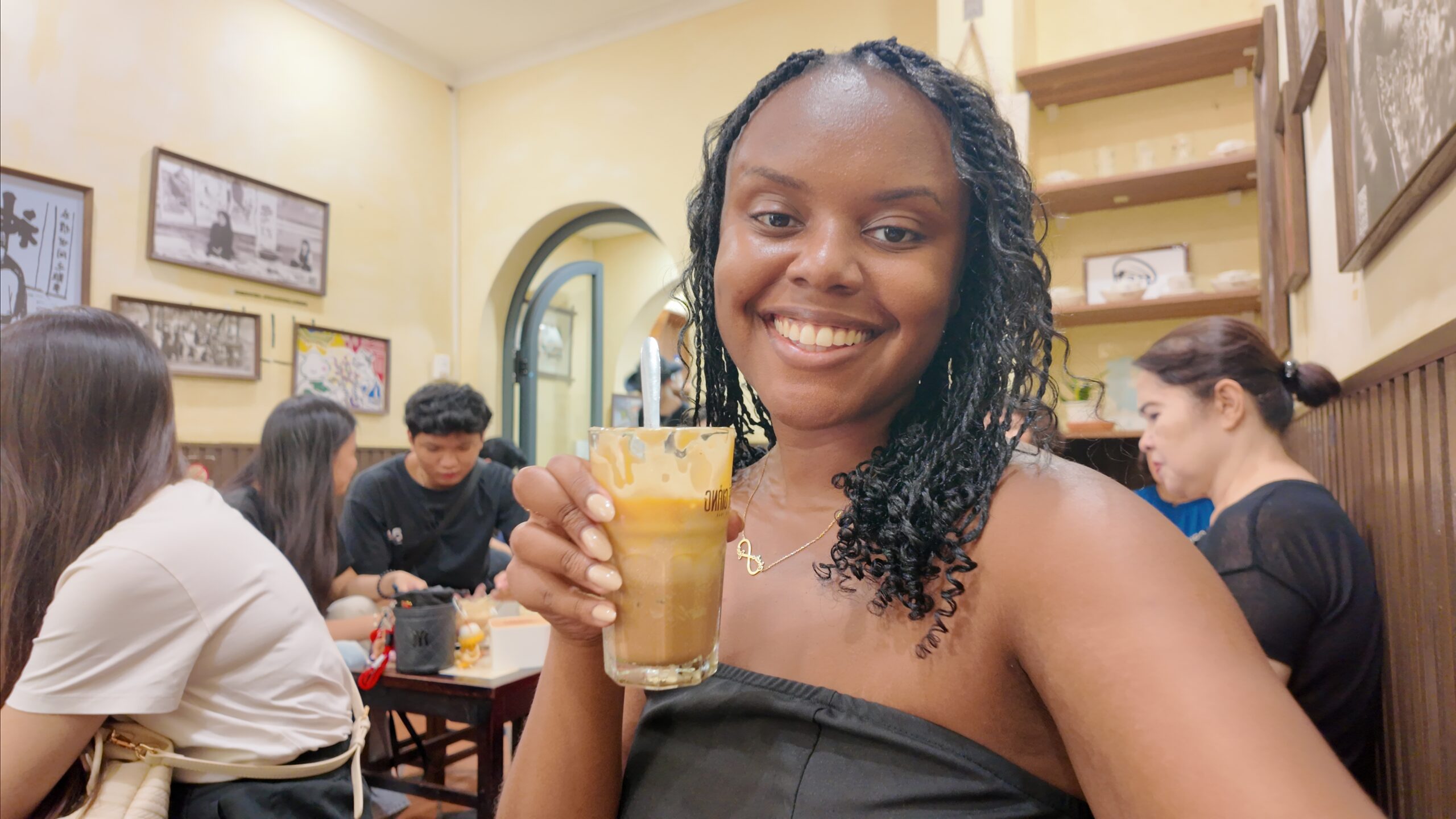 Christina Jane trying egg coffee at Cafe Giang in Hanoi 