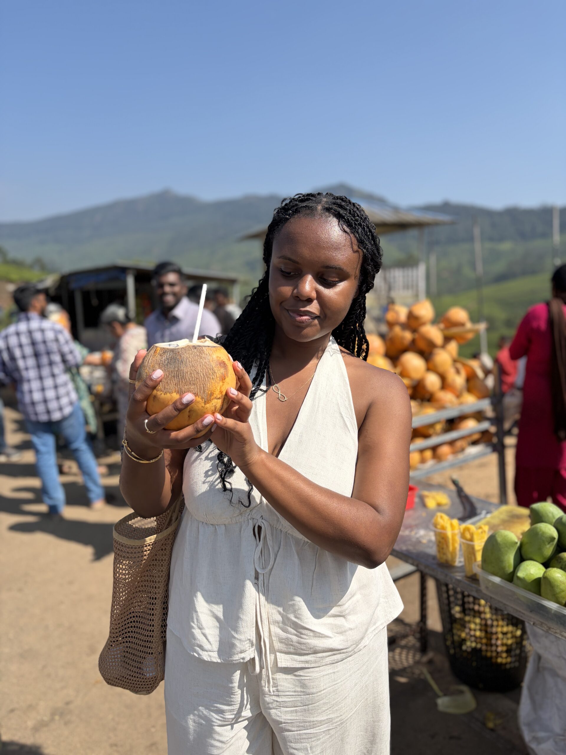 Christina holding a coconut